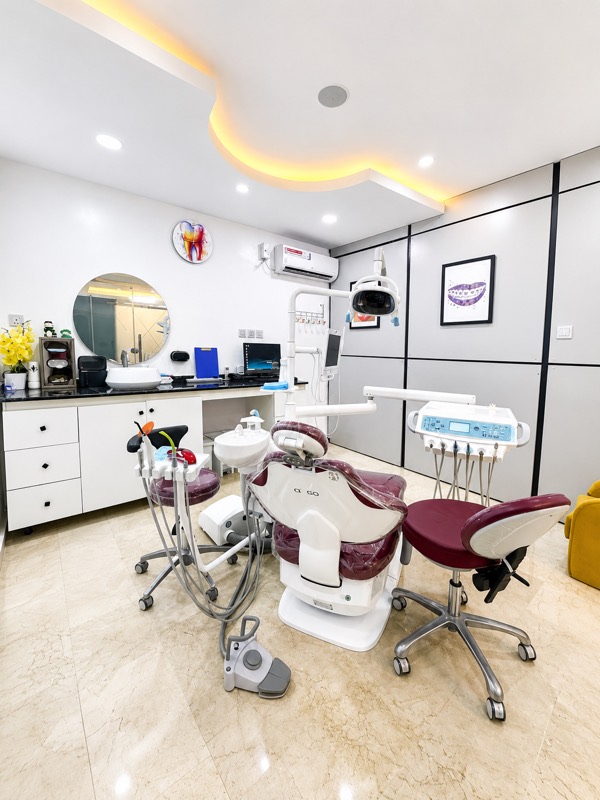 Inside a Glaze private surgery in Lekki, warm cove lighting and the words be the reason someone smiles today